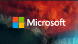 Microsoft logo on a colorful mozaic background