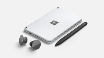 Surface Duo, closed, with Slim Pen and Surface Earbuds