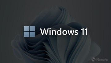 An image with a colorful Windows 11 logo and dimmed background